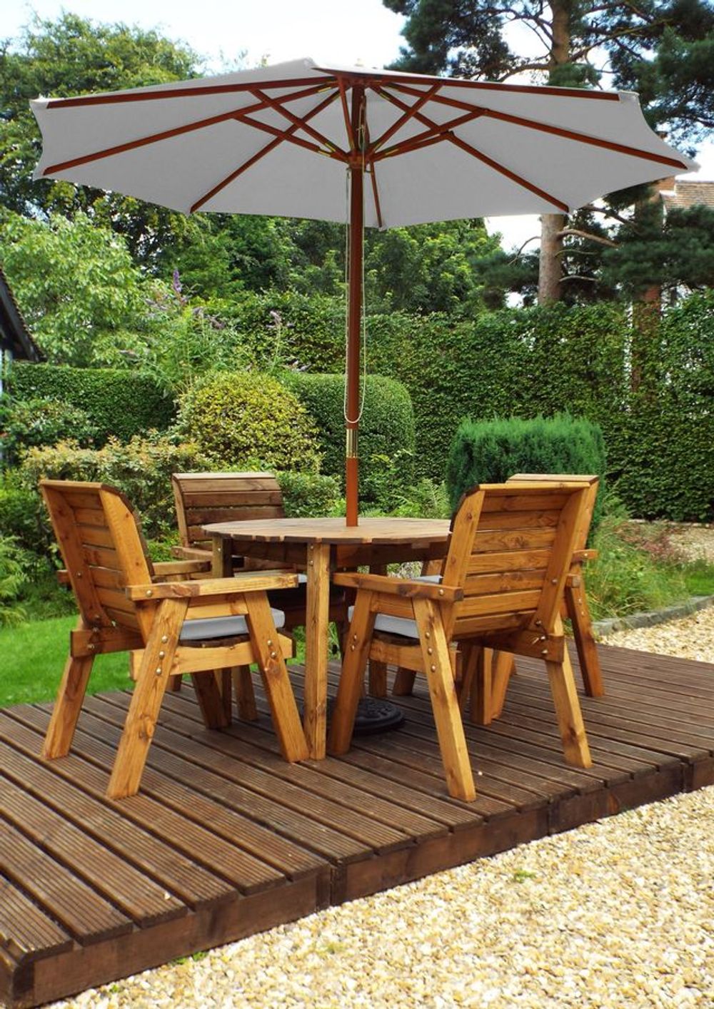 Charles Taylor solid wood outdoor four seater circular dining set with 4x armchairs