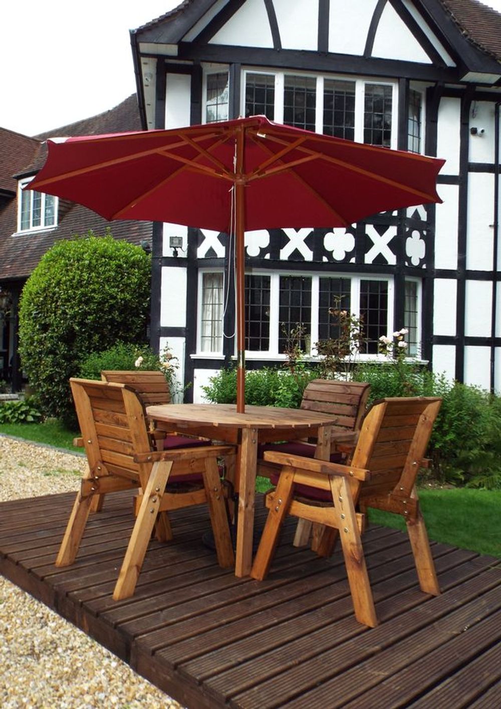 Charles Taylor solid wood outdoor four seater circular dining set with 4x armchairs