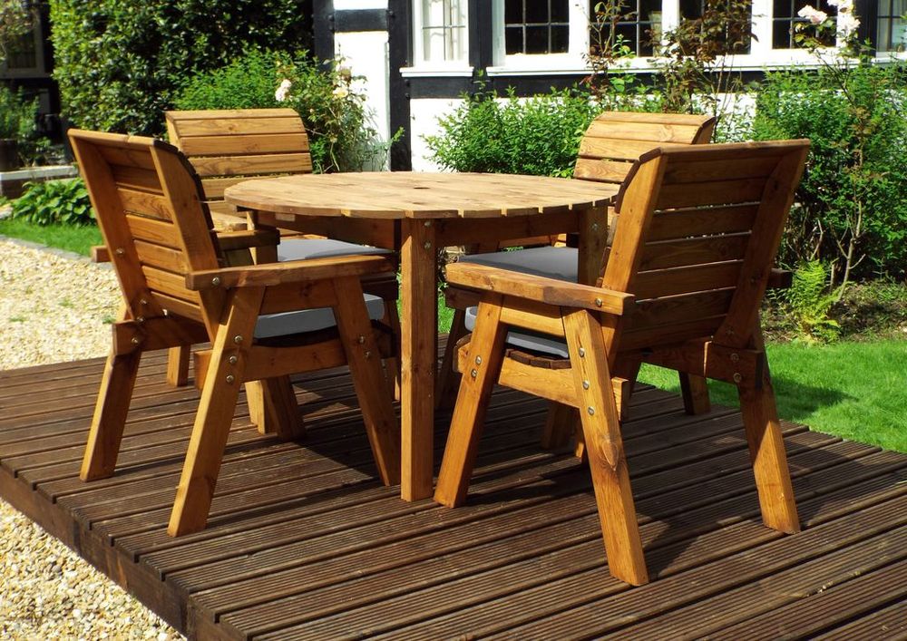 Charles Taylor solid wood outdoor four seater circular dining set with 4x armchairs