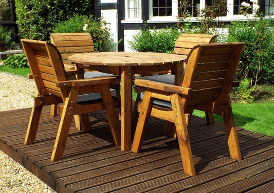 Charles Taylor solid wood outdoor four seater circular dining set with 4x armchairs