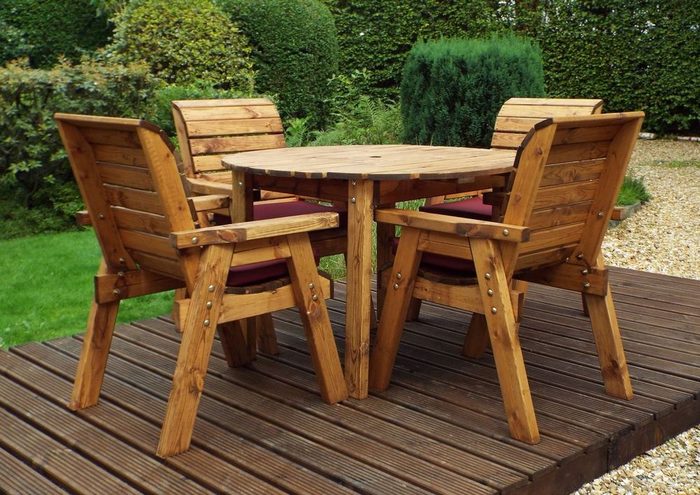 Charles Taylor solid wood outdoor four seater circular dining set with 4x armchairs
